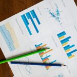 Top view of vibrant charts and colored pencils on wooden surface. — Photo by RDNE Stock project on Pexels